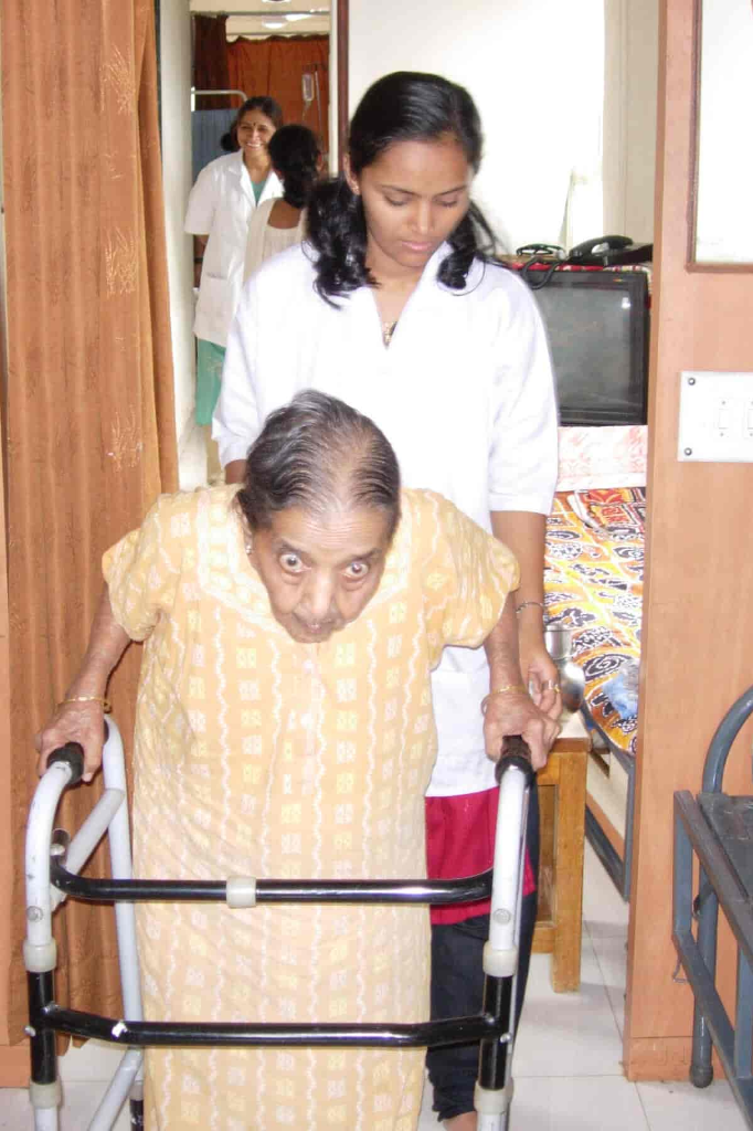 Attendant guiding patient walker exercises